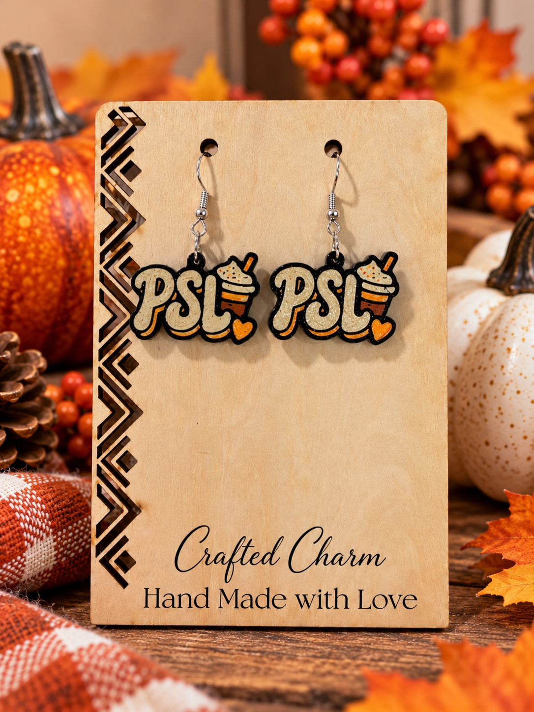 PSL 3D printed pumpkin spice latte dangle earrings on autumn display