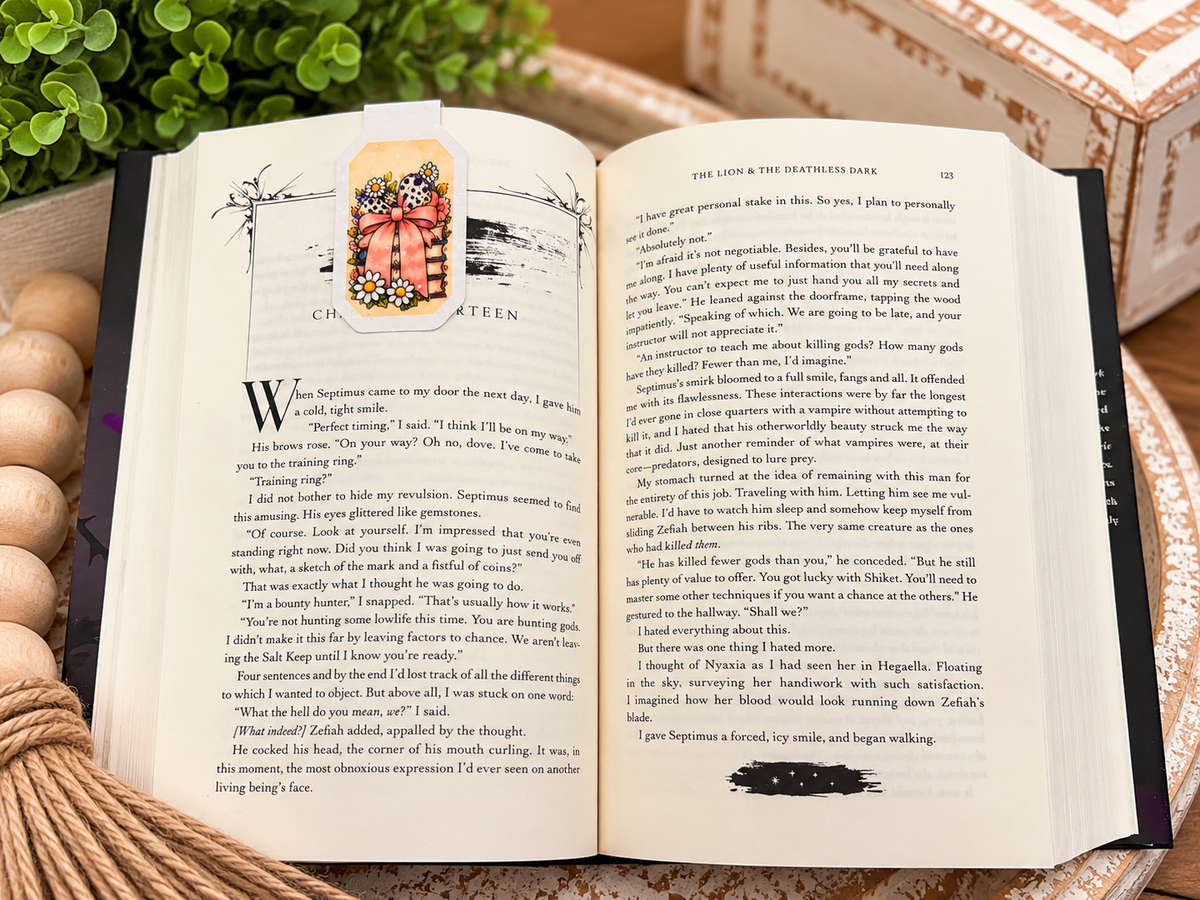 Back of Good Books Brighter Days magnetic bookmark clipped over an open book
