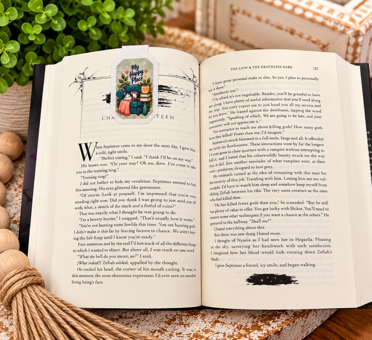 My Happy Place magnetic bookmark front clipped over an open book