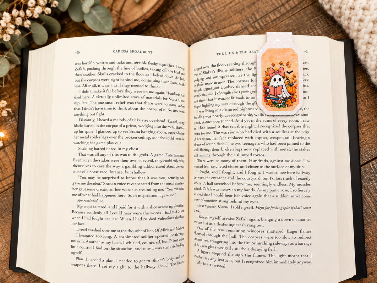 Spooky Season Reads magnetic bookmark reverse side clipped over a book page